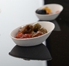A Picture of product FIS-42MAB01 Conserveware Mini Angled Bagasse Bowls. 3/4 oz. 3.2 X 2 in. White. 25/bag, 20 bags/case.